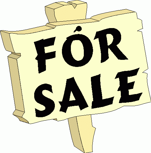 A rough wood, yellow lawn sign that says "For Sale" in black letters