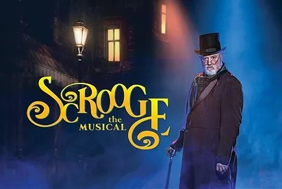 A man in a top hat and black coat and carrying a cane on a dark London street with the show title in yellow script letters